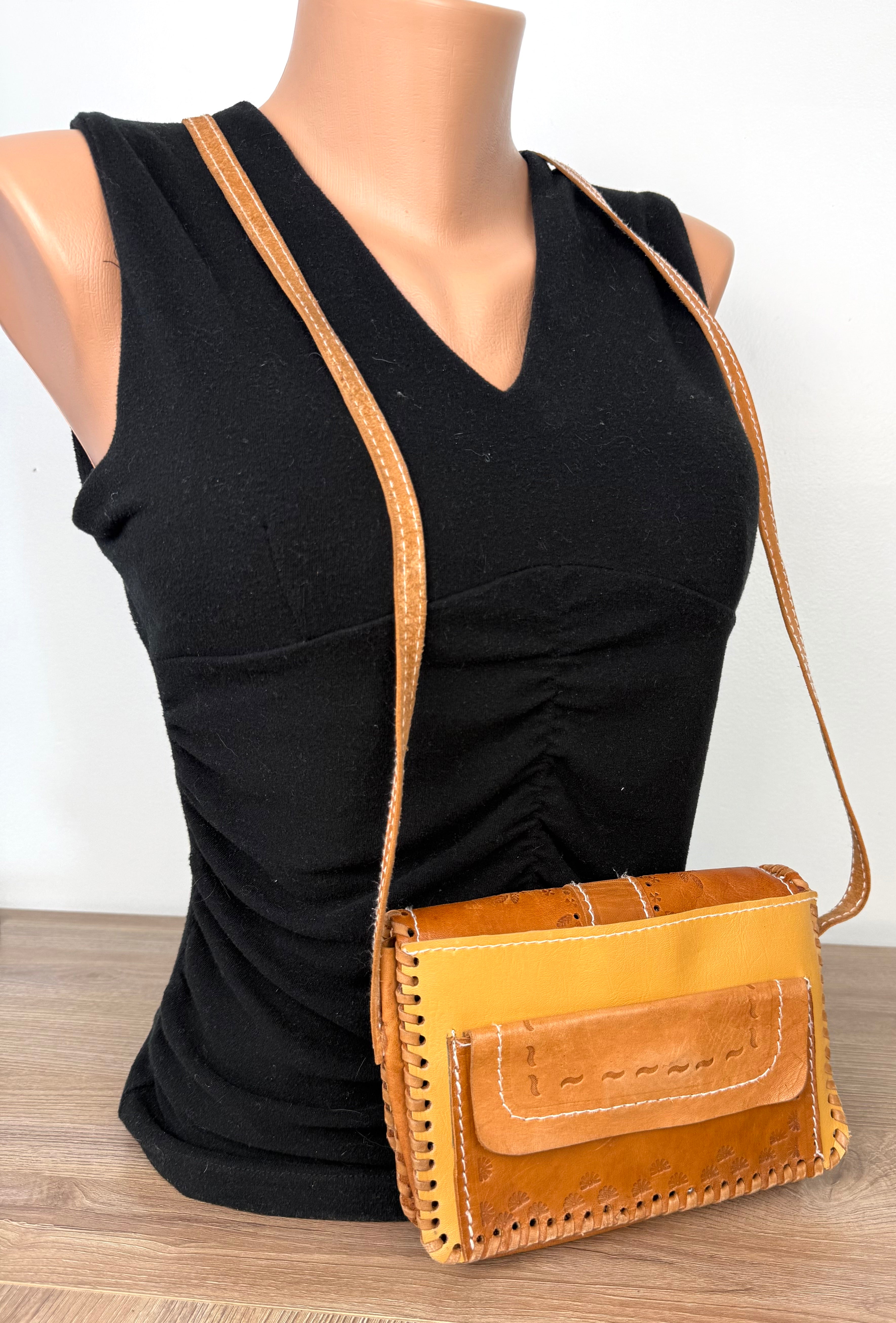 back of Vintage Hand-Tooled Leather Crossbody Bag at Blue Sparrow Shop on mannequin to show size