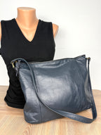 back of Vintage Rowland Leather Shoulder Bag in Navy Blue on mannequin to show size