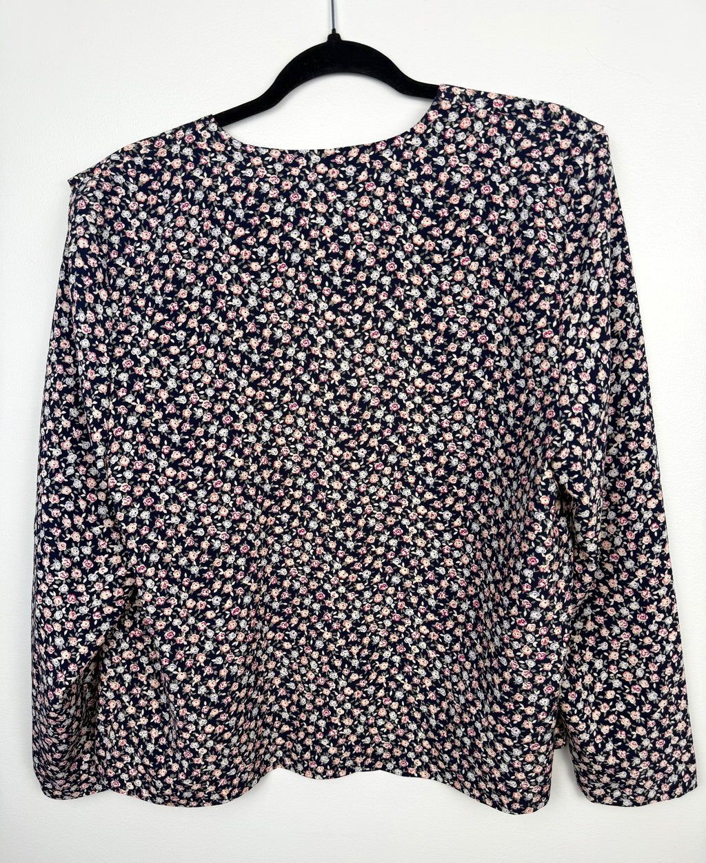 back of Vintage floral print navy Jacket Made in Canada at Blue Sparrow Shop  on hanger