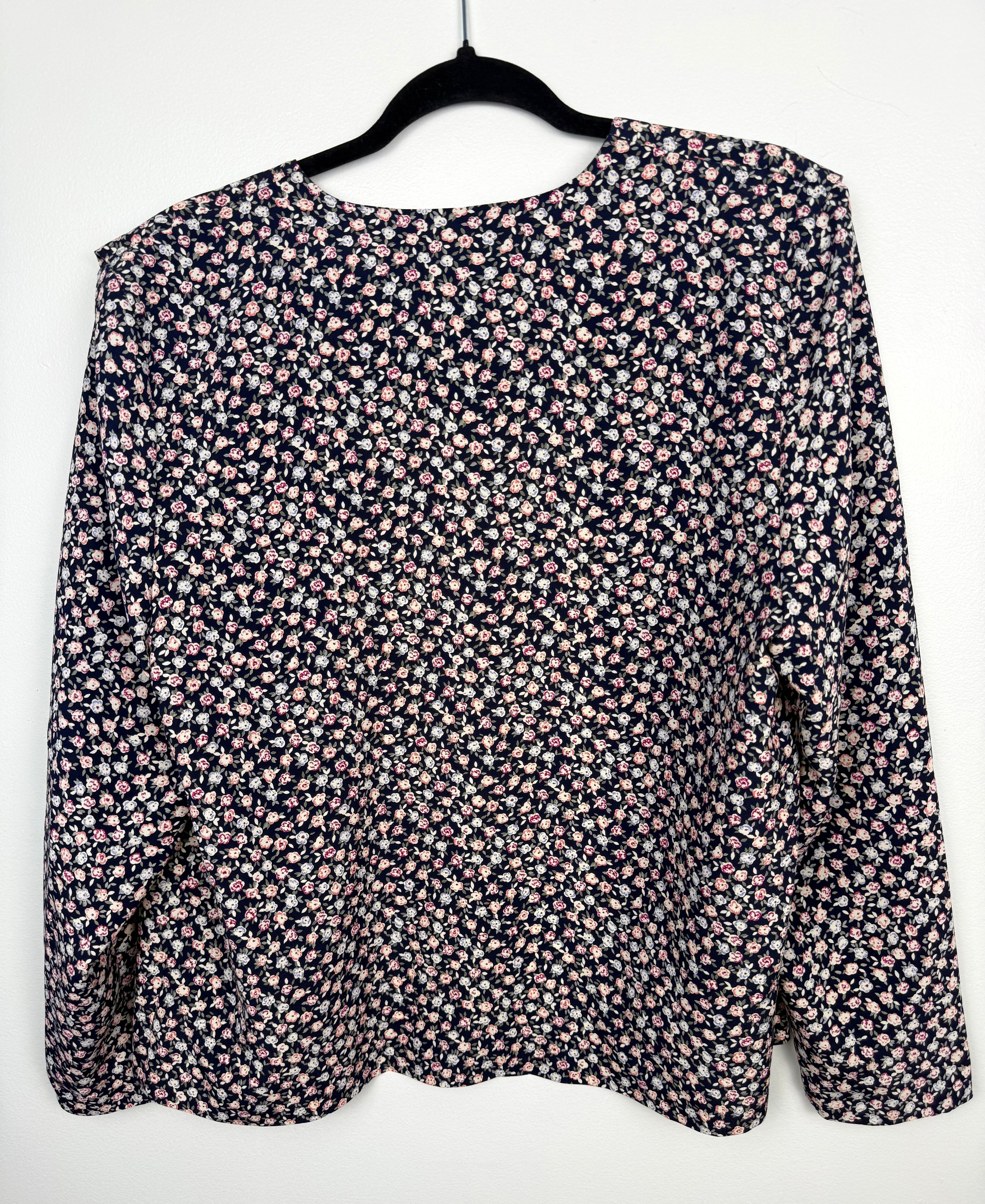 back of Vintage floral print navy Jacket Made in Canada at Blue Sparrow Shop  on hanger