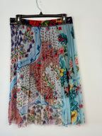 Floral patterned boho skirt on a hanger against a white background