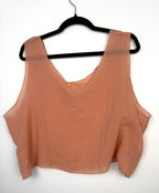 back of inda lundstrom peach silk crop top on hanger