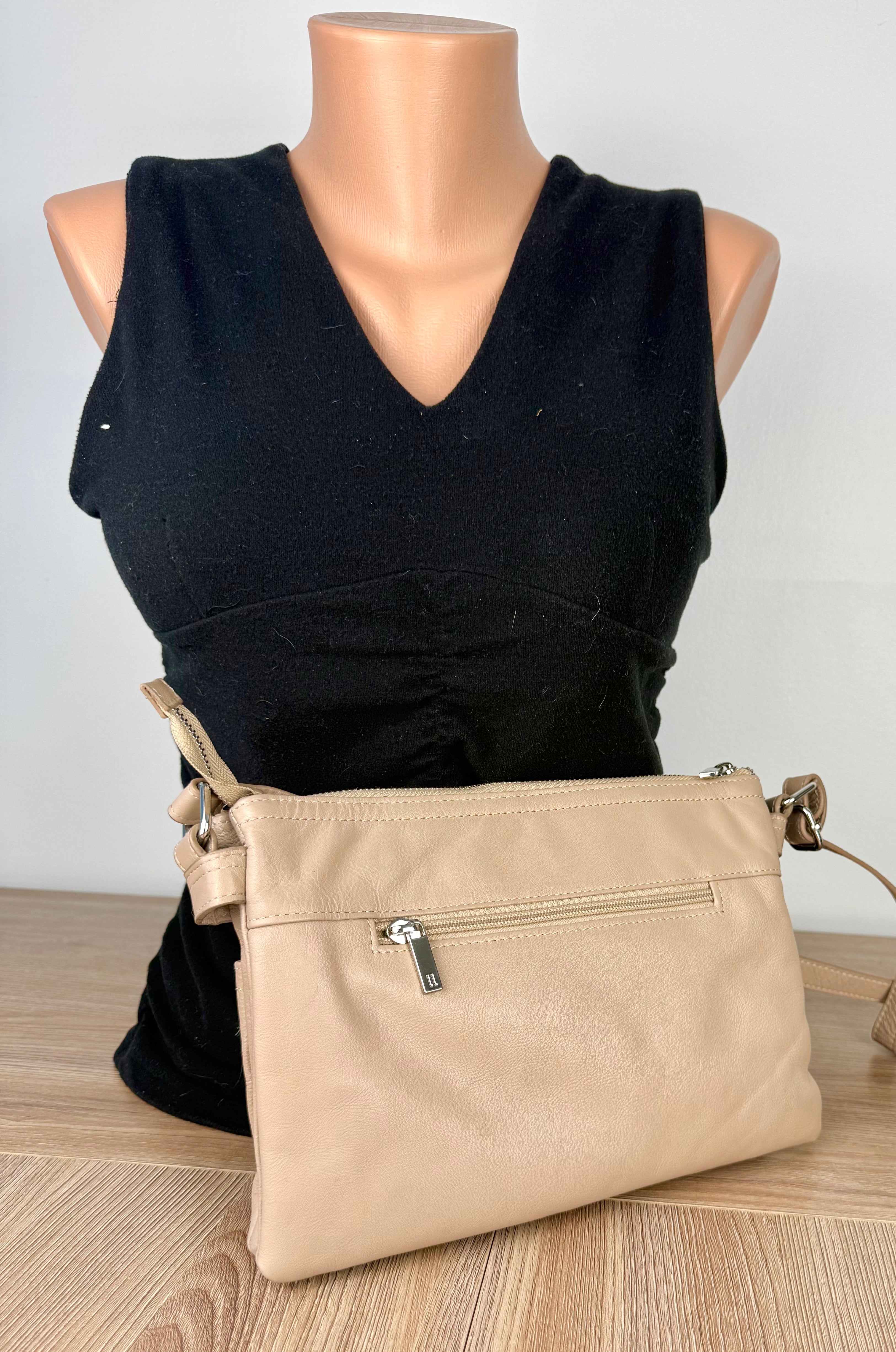back of pelle italian leather cross body travel bag on mannequin for scale 