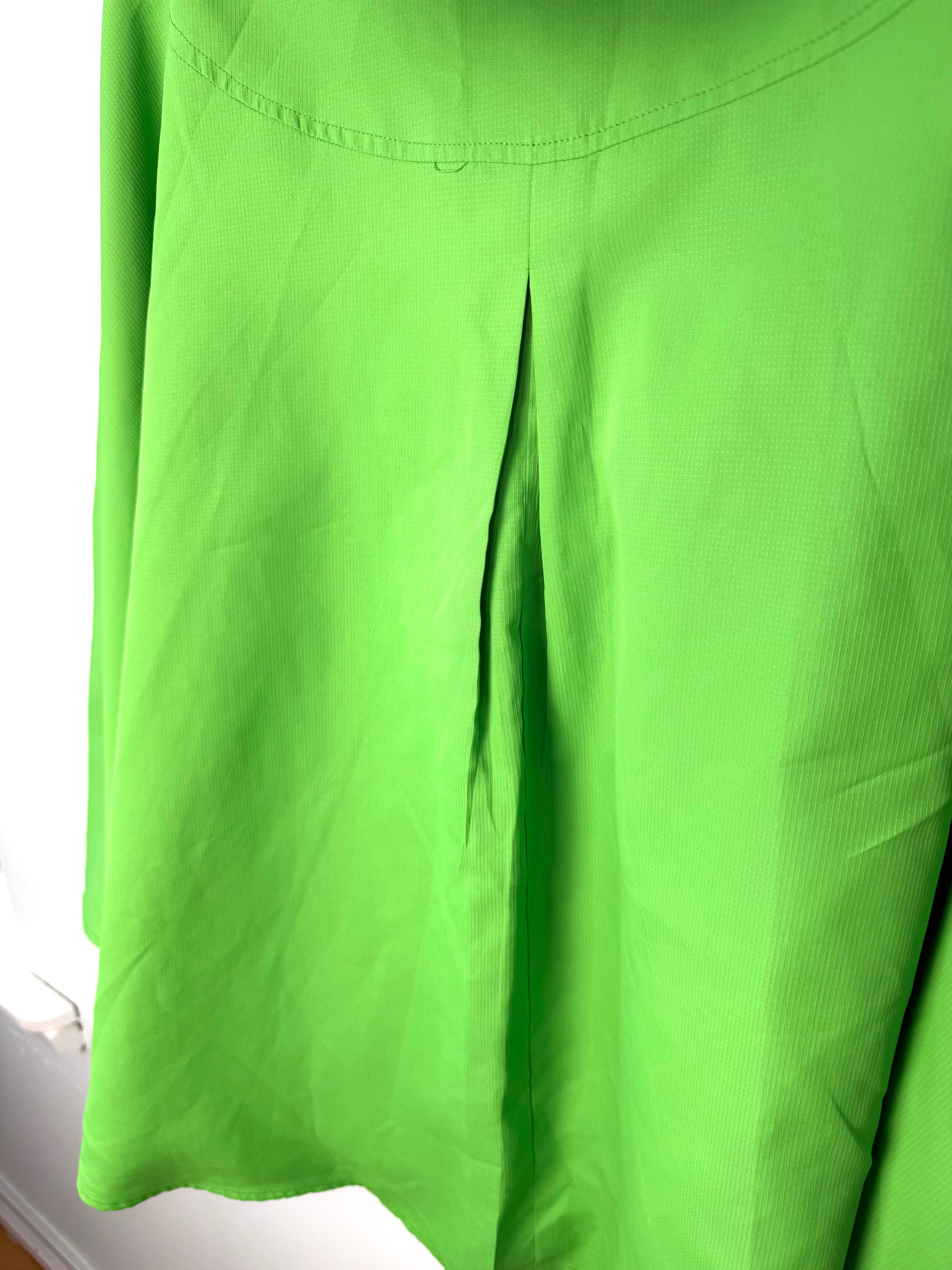 back pleat detail on women’s statement raincoat bold neon green outerwear 