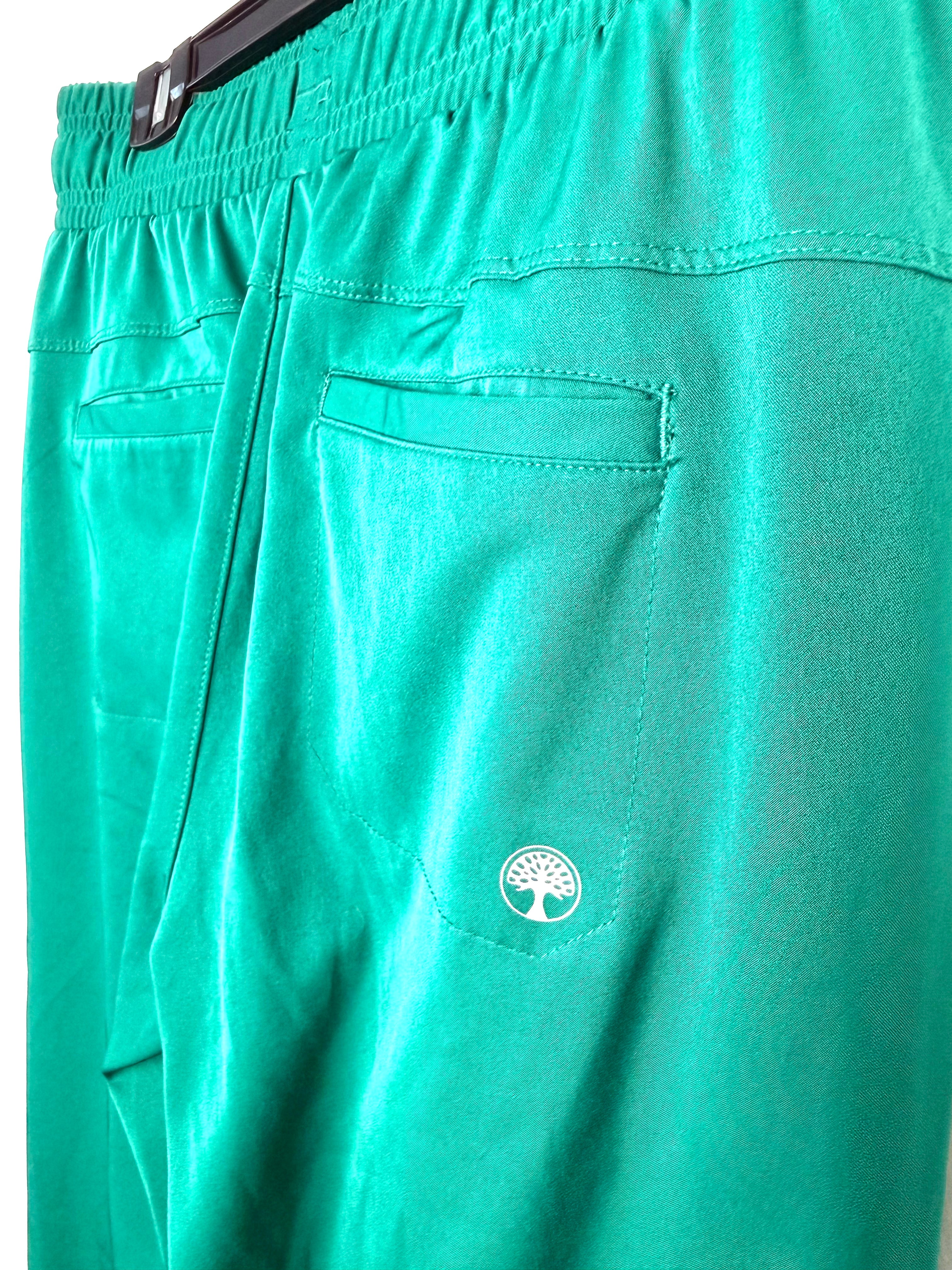 back pocket detail  on Healing Hands scrub pants / casual pants in emerald green showing healing hands logo 