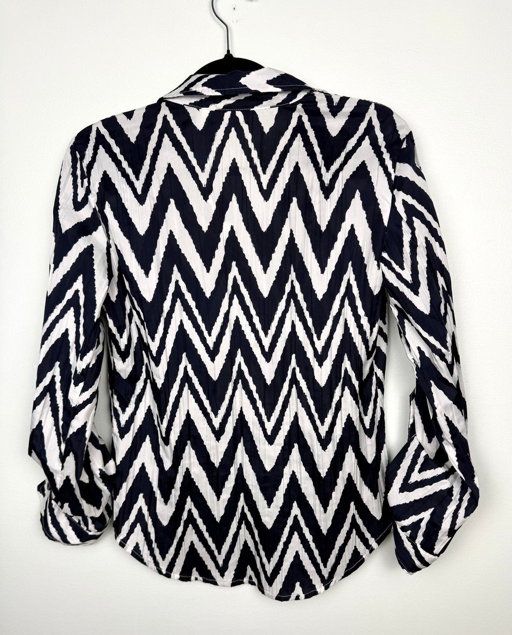 back view of Nautical inspired women’s blouse with bold chevron pattern by Chicos