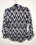 back view of Nautical inspired women’s blouse with bold chevron pattern by Chicos