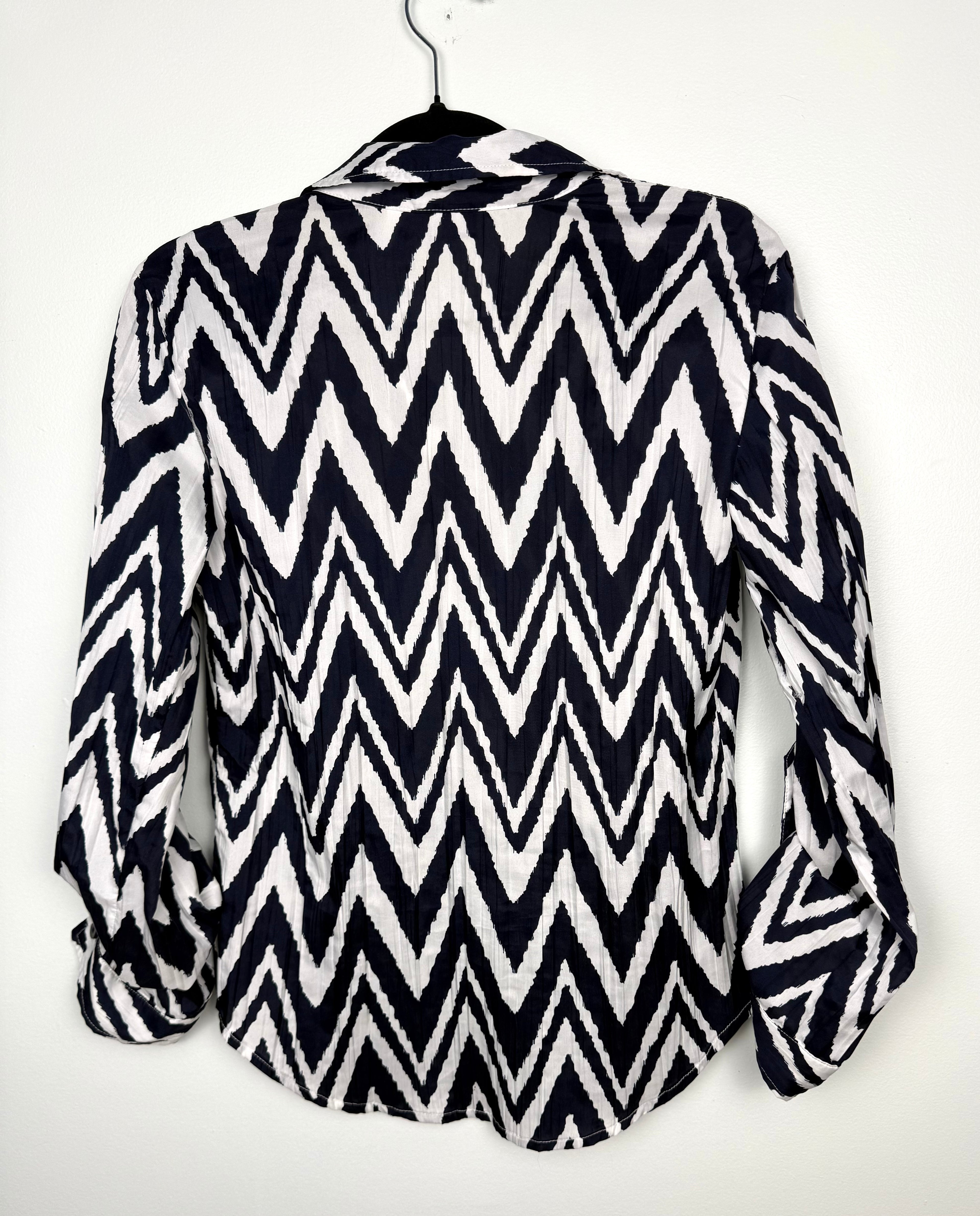 back view of Nautical inspired women’s blouse with bold chevron pattern by Chicos