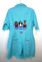 back view of Oversized Turquoise denim romper on hanger