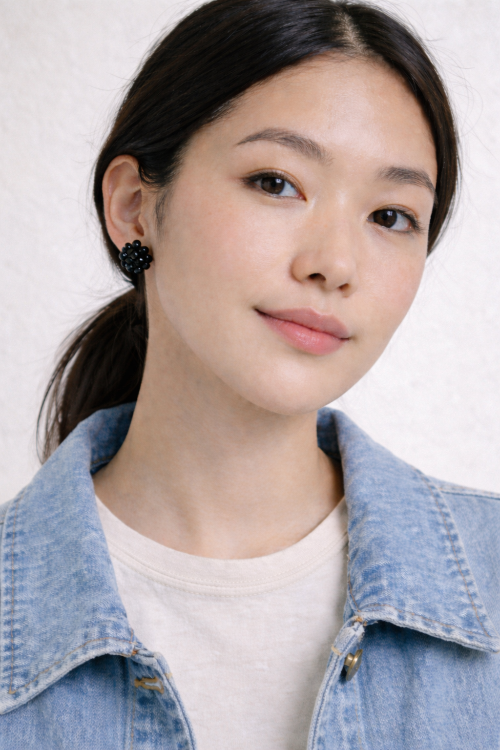 black vintage seed bead earrings at Blue Sparrow Shop on woman wearing denim jacket 