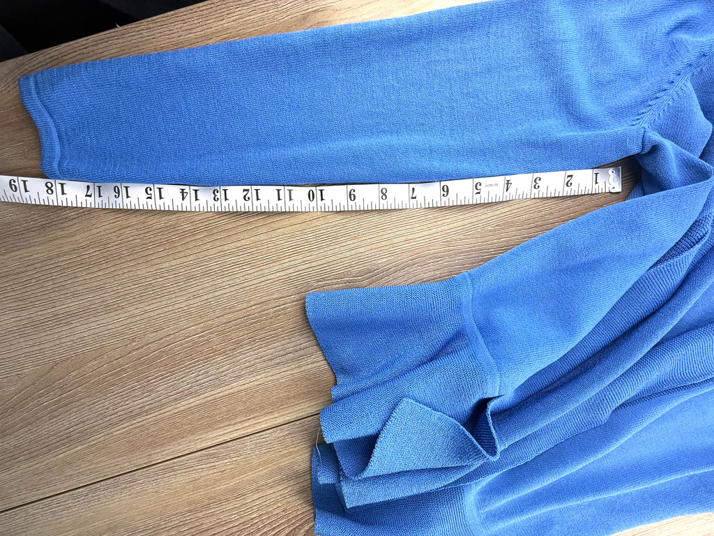 blue lightweight cardigan with peplum waist measuring 18" sleeve length 