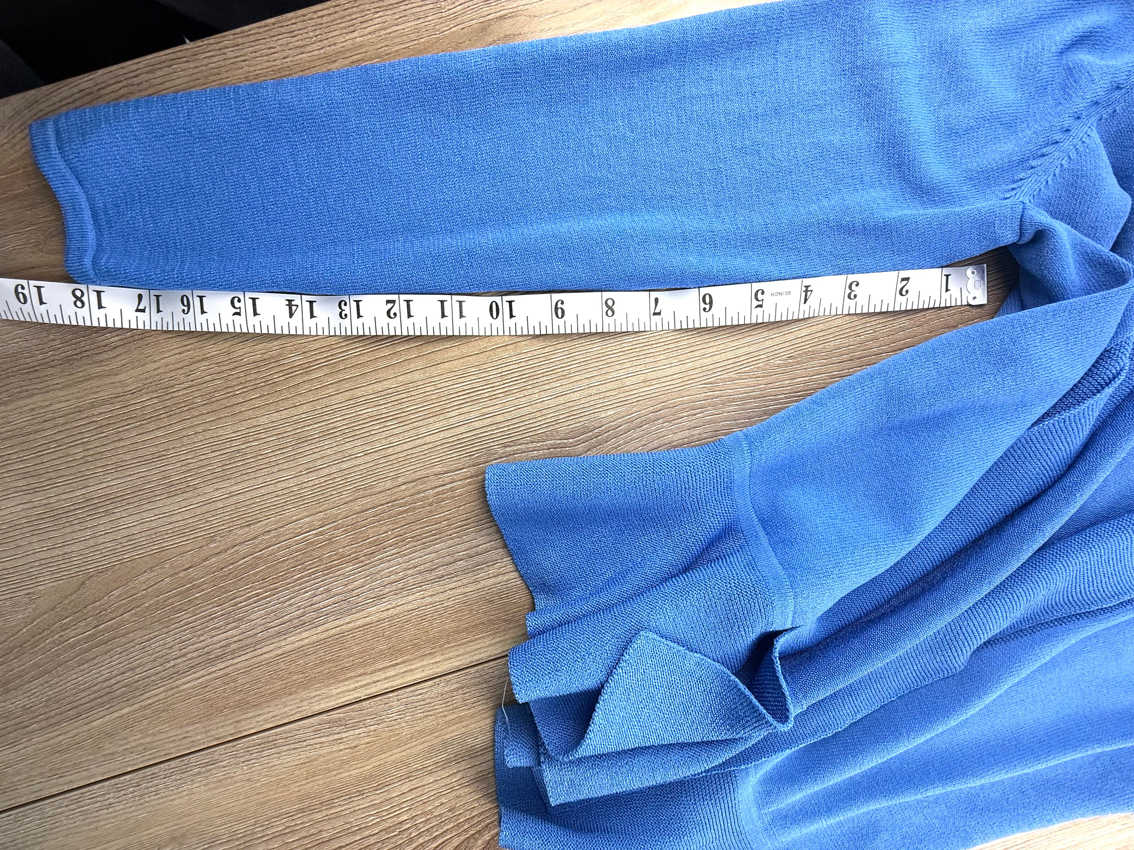 blue lightweight cardigan with peplum waist measuring 18" sleeve length 