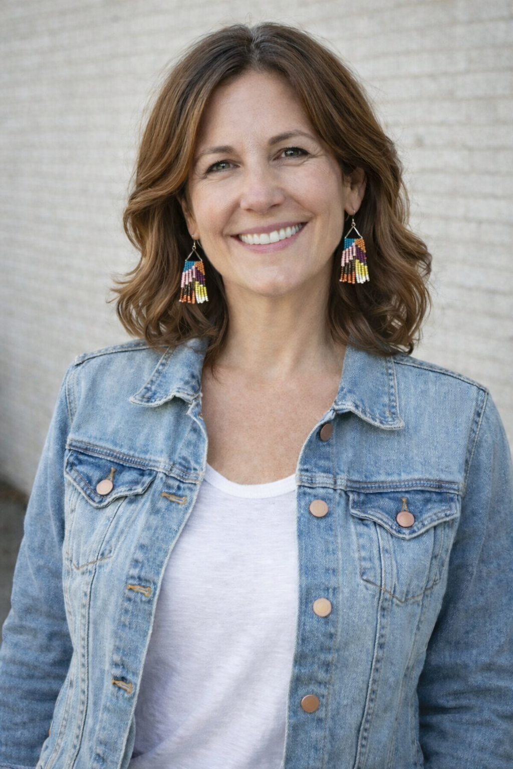 boho beaded fringe earrings at Blue Sparrow Shop on woman wearing denim jacket 