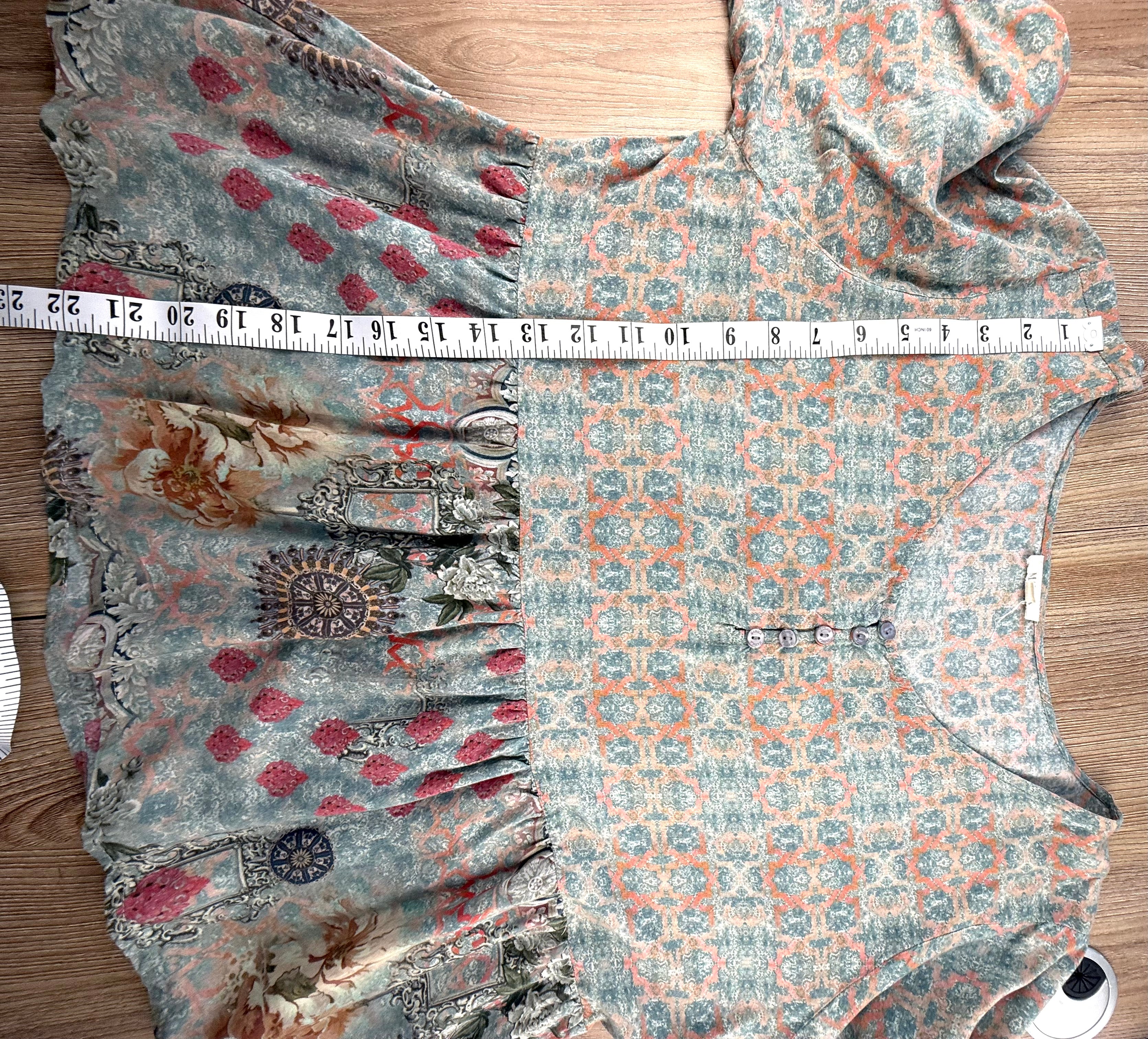 boho peasant style top with peplum waist measuring 22" shoulder to hem 