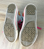 bottoms of  Converse Chuck Taylor All Star Kids High Top Sneakers showing little wear 