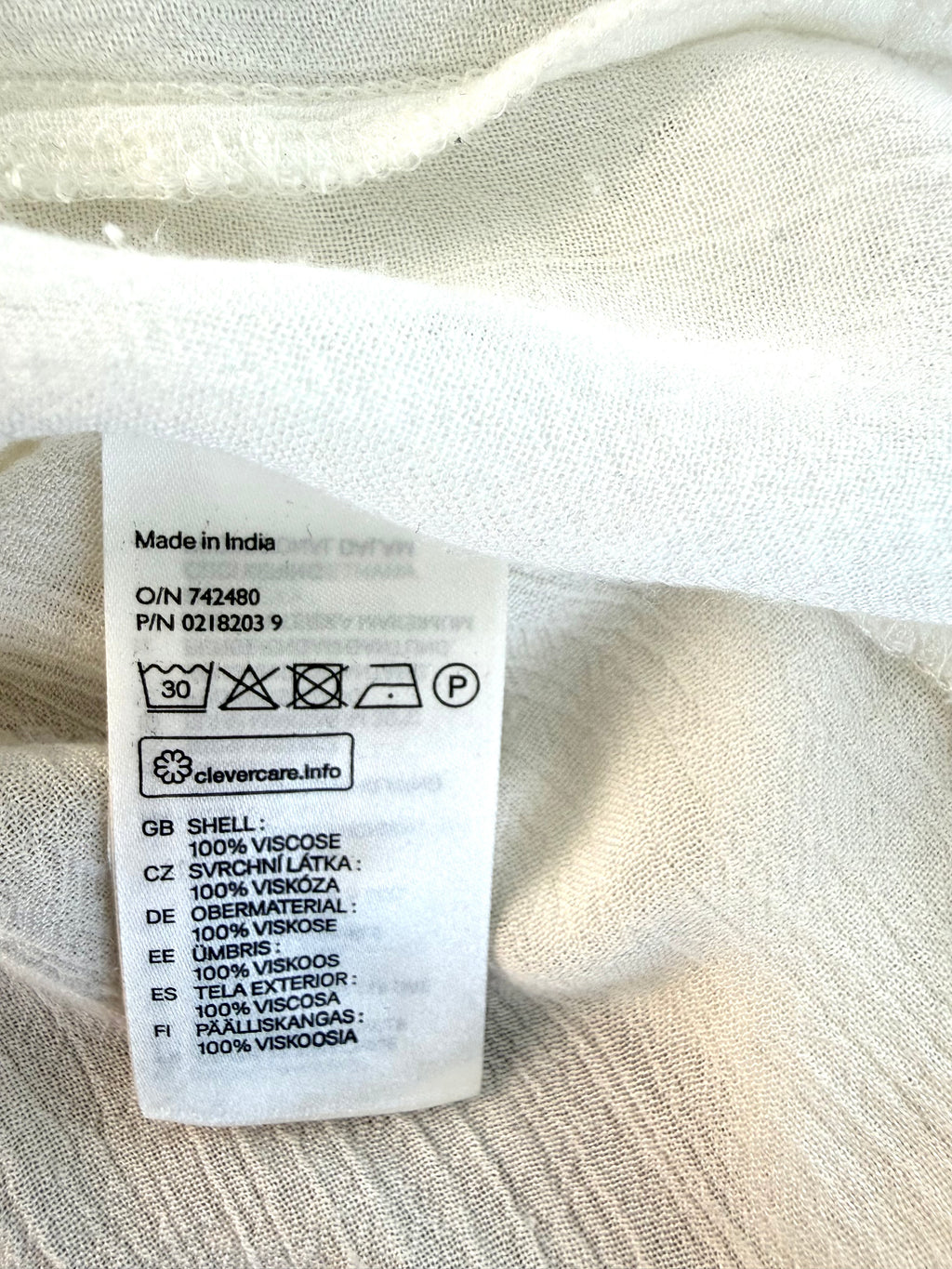 care tag inside Oversized H & M boho peasant blouse 
