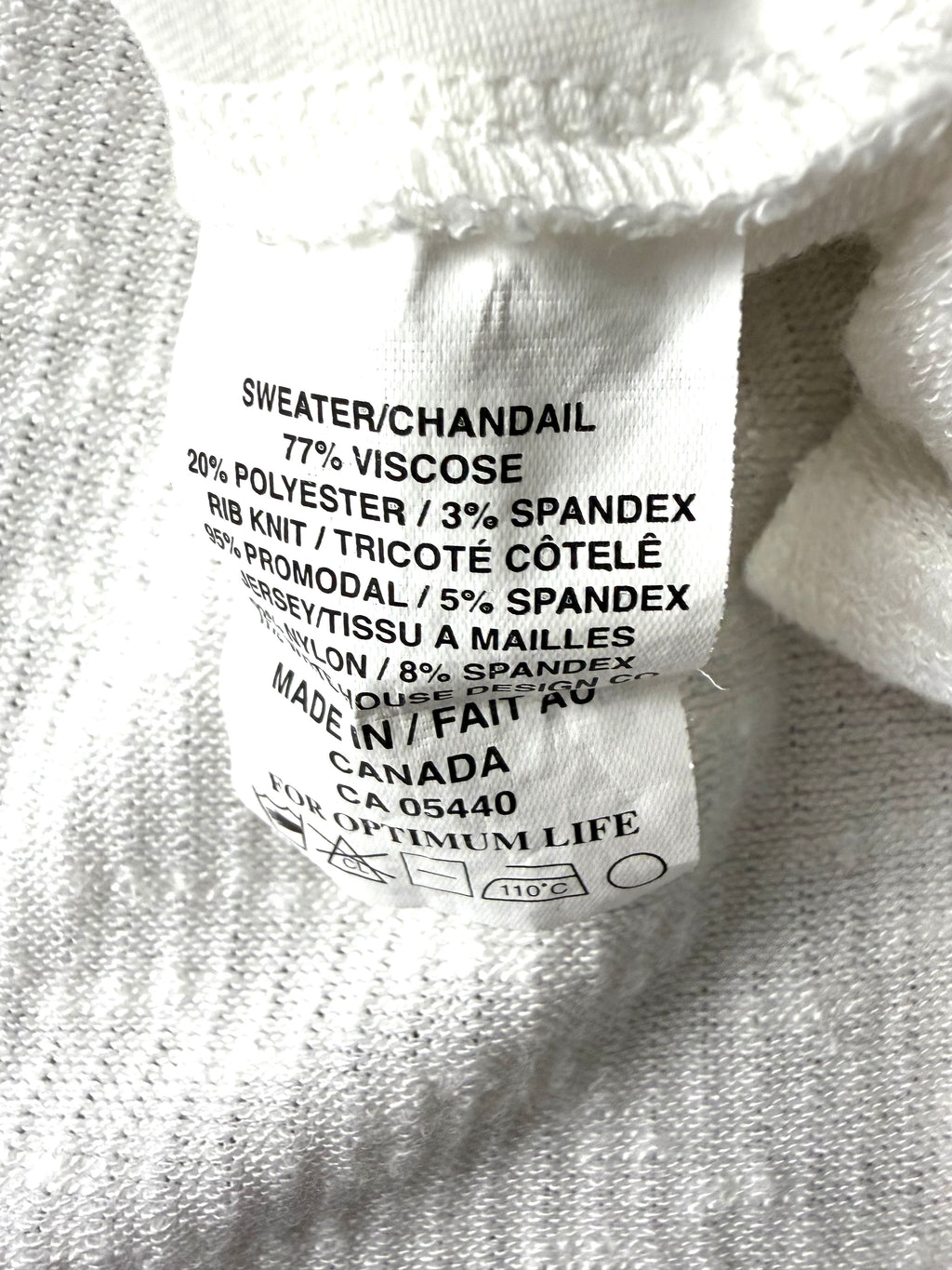 care tag inside Sympli Made in Canada White Asymmetrical Tunic Top | Rib Knit Stretch Travel Top