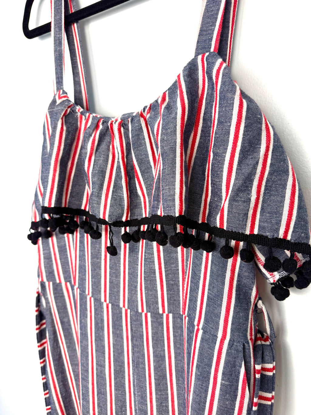 close up of bust detail on Made in Italy Cotton Linen Stripe Wide-Leg Jumpsuit — Denim Blue, Red & White | Pom-Pom Trim | Size M at Blue Sparrow Shop 