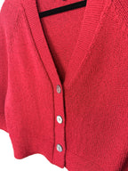 close up of buttons on front of jones new york red cardigan