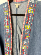 close up of colourful southwestern embroidery on denim