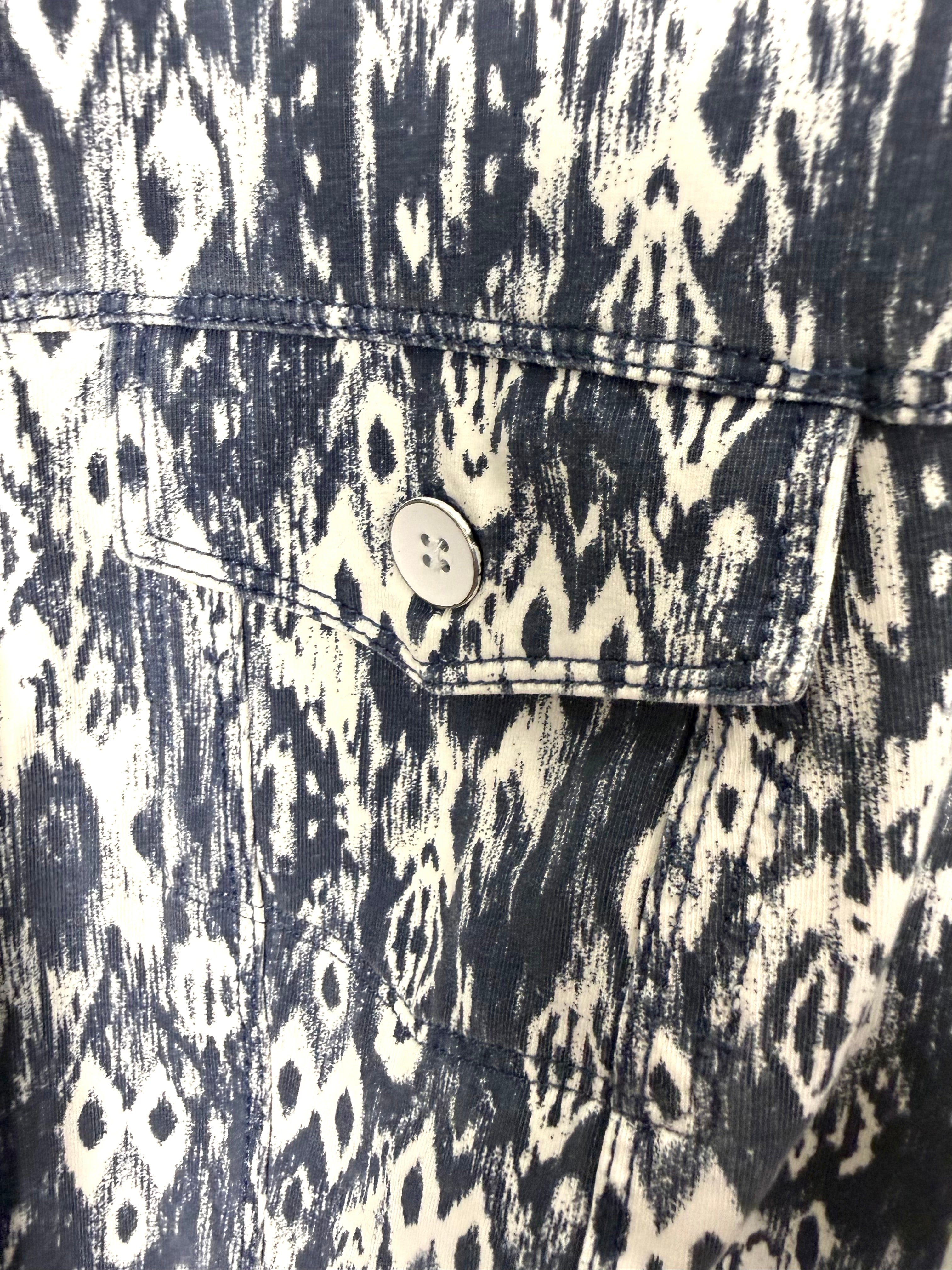 close up of front pocket on Sandwich brand jacket in denim blue and white