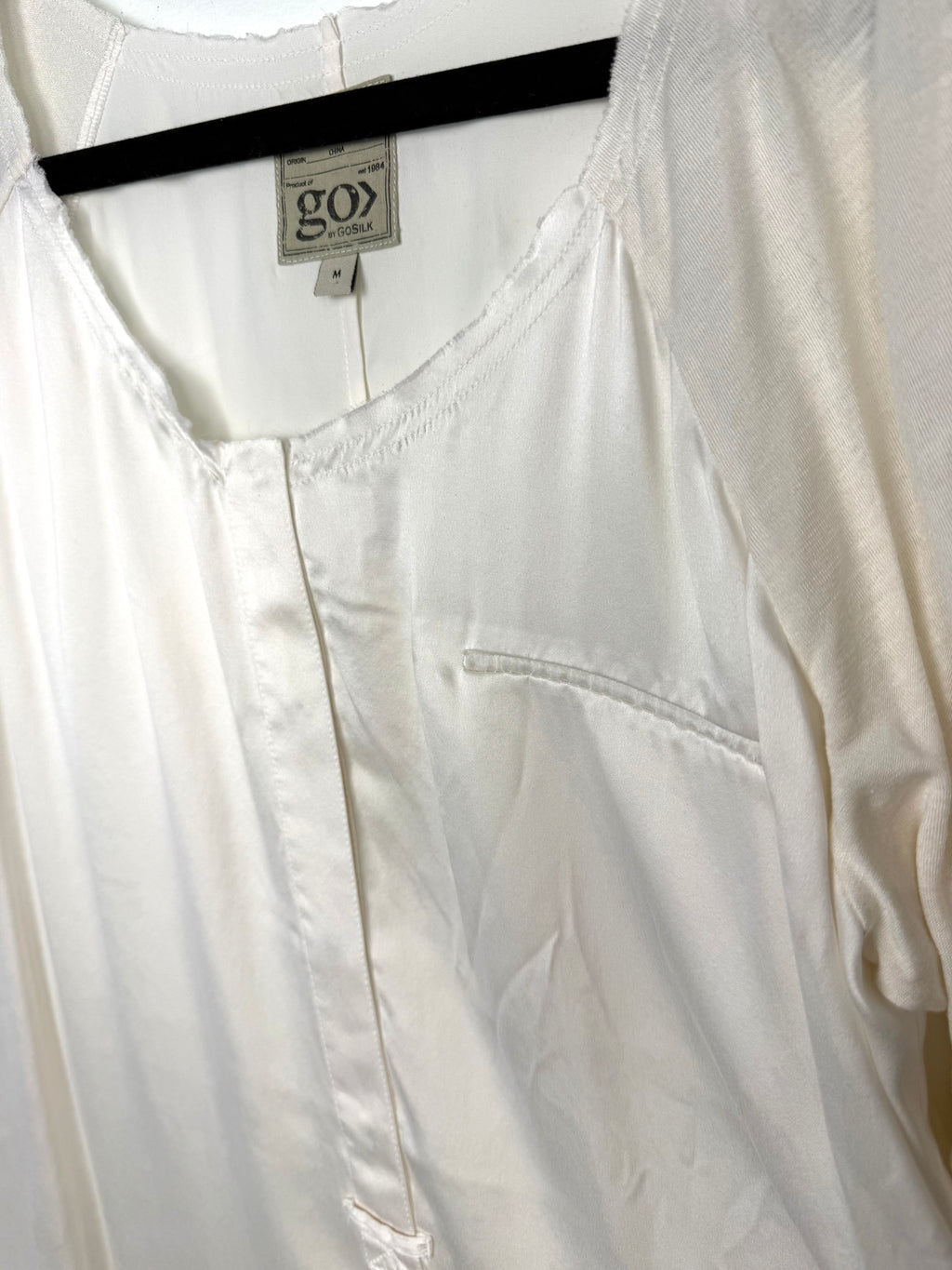 close up of front tags on Resale Go Silk Washable Silk Long Sleeve Blouse at Blue Sparrow Shop