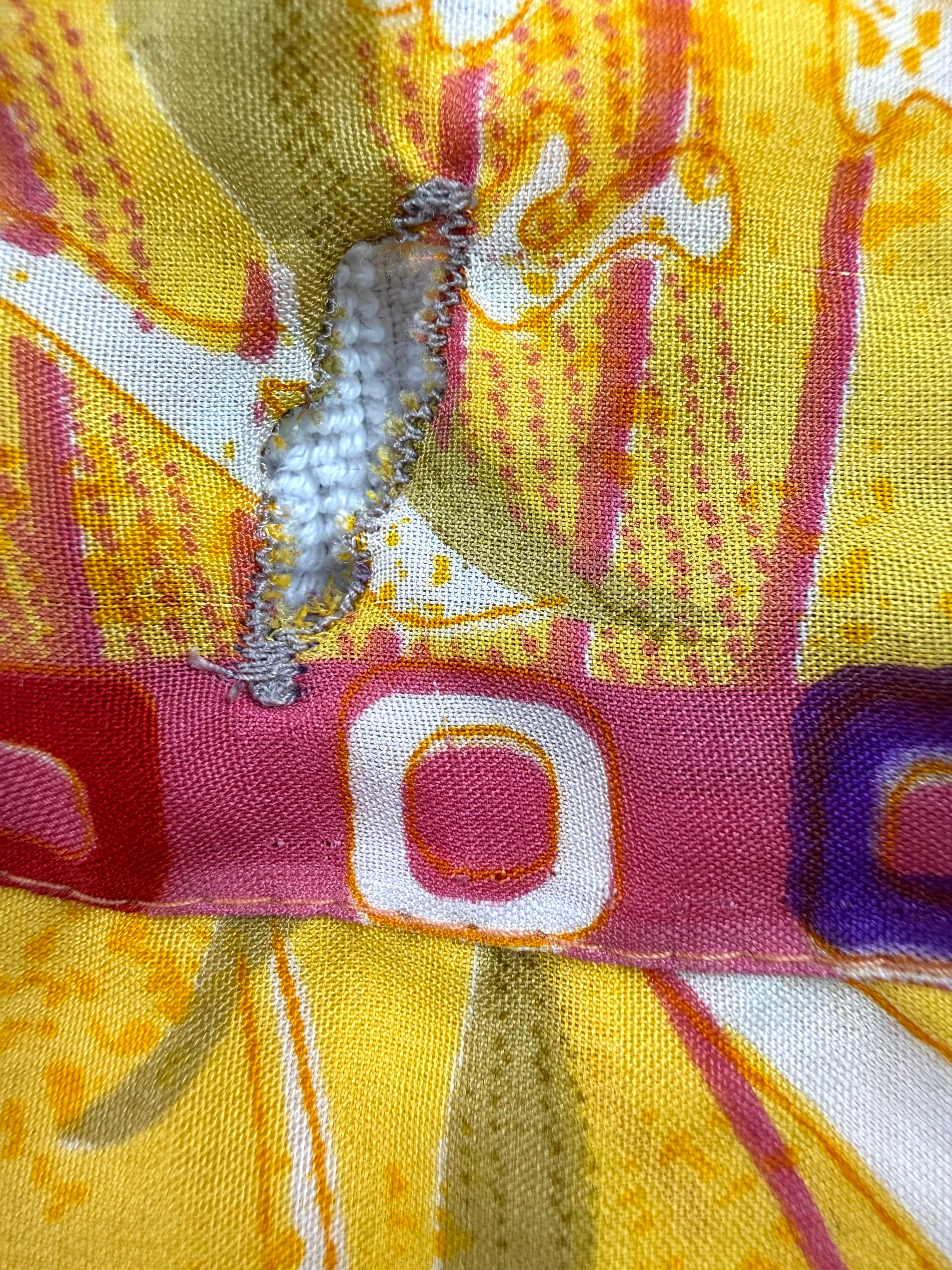 close up of hole to put strap through on 80% Silk Reversible Tropical Floral Wrap Skirt  at Blue Sparrow Shop