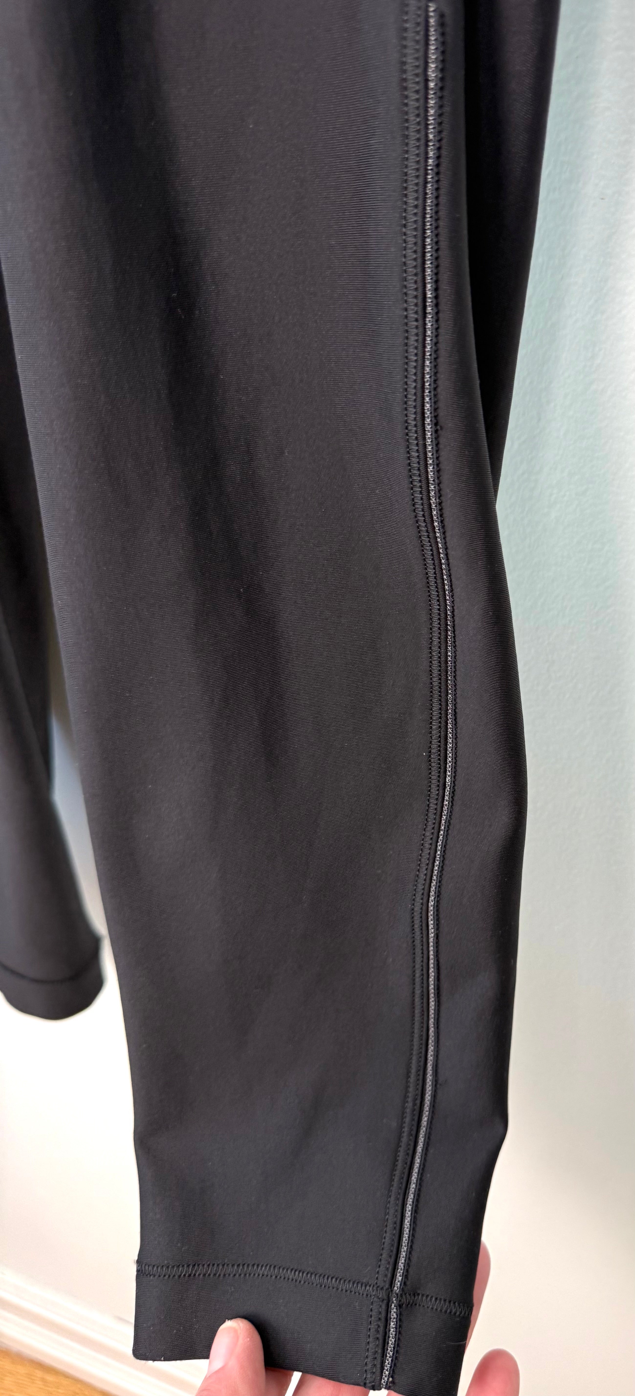 close up of leg on Lululemon Black High Waisted Leggings | Size 8 at Blue Sparrow Shop