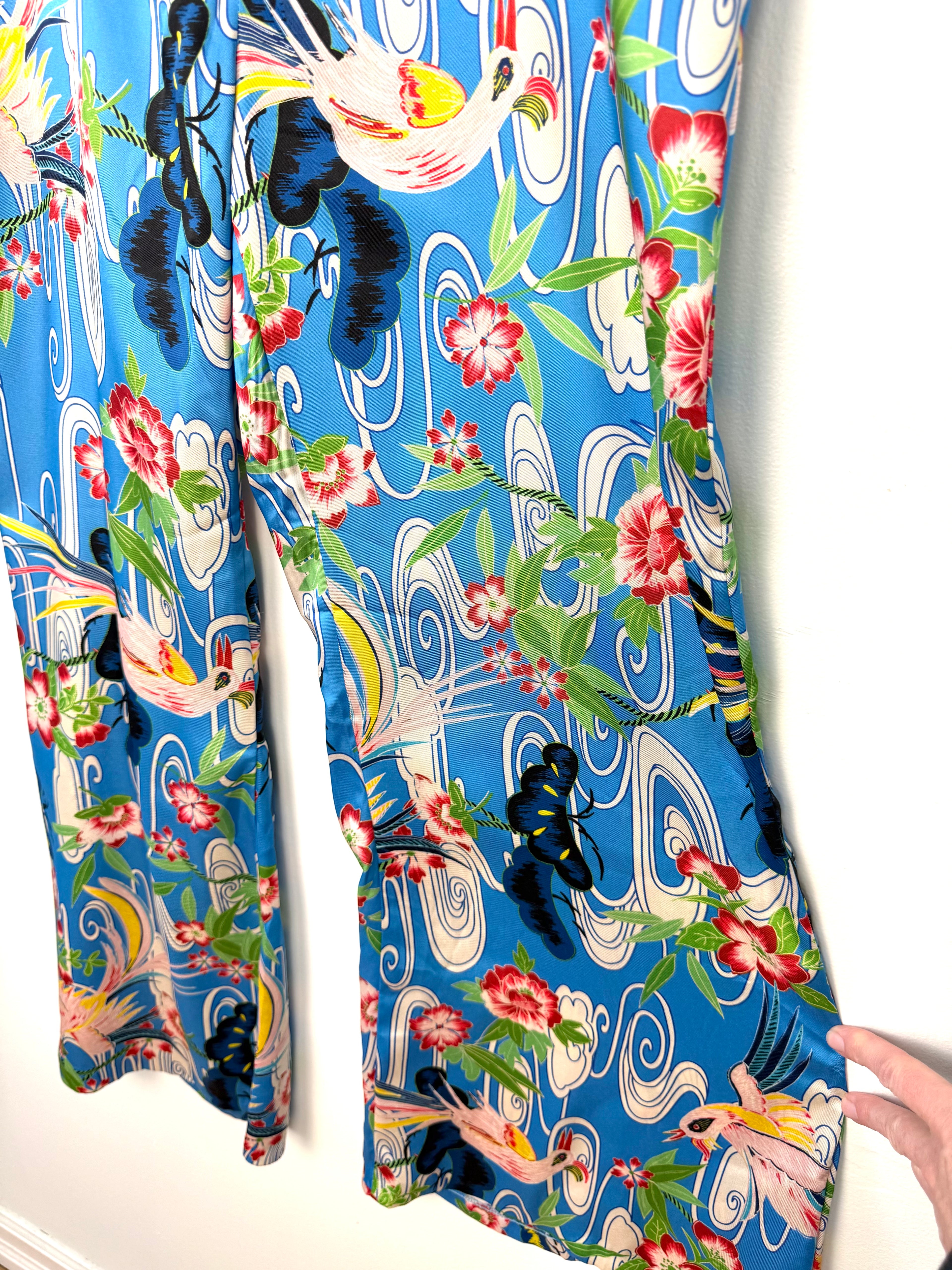 close up of leg on Zara blue tropical bird floral wide leg pants