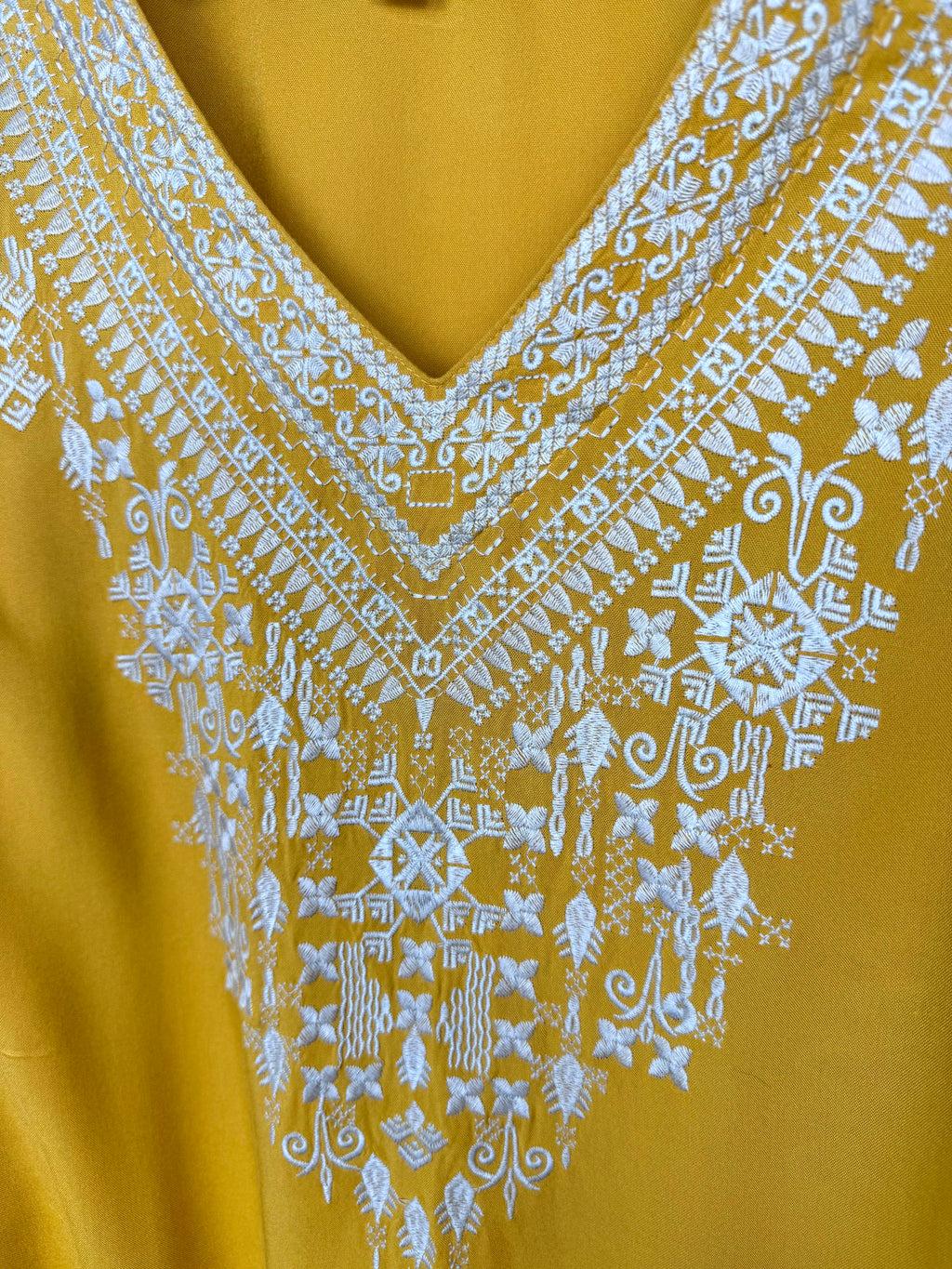 close up of neckline on Chelsea & Theodore Embroidered Boho Blouse 