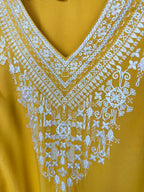 close up of neckline on Chelsea & Theodore Embroidered Boho Blouse 