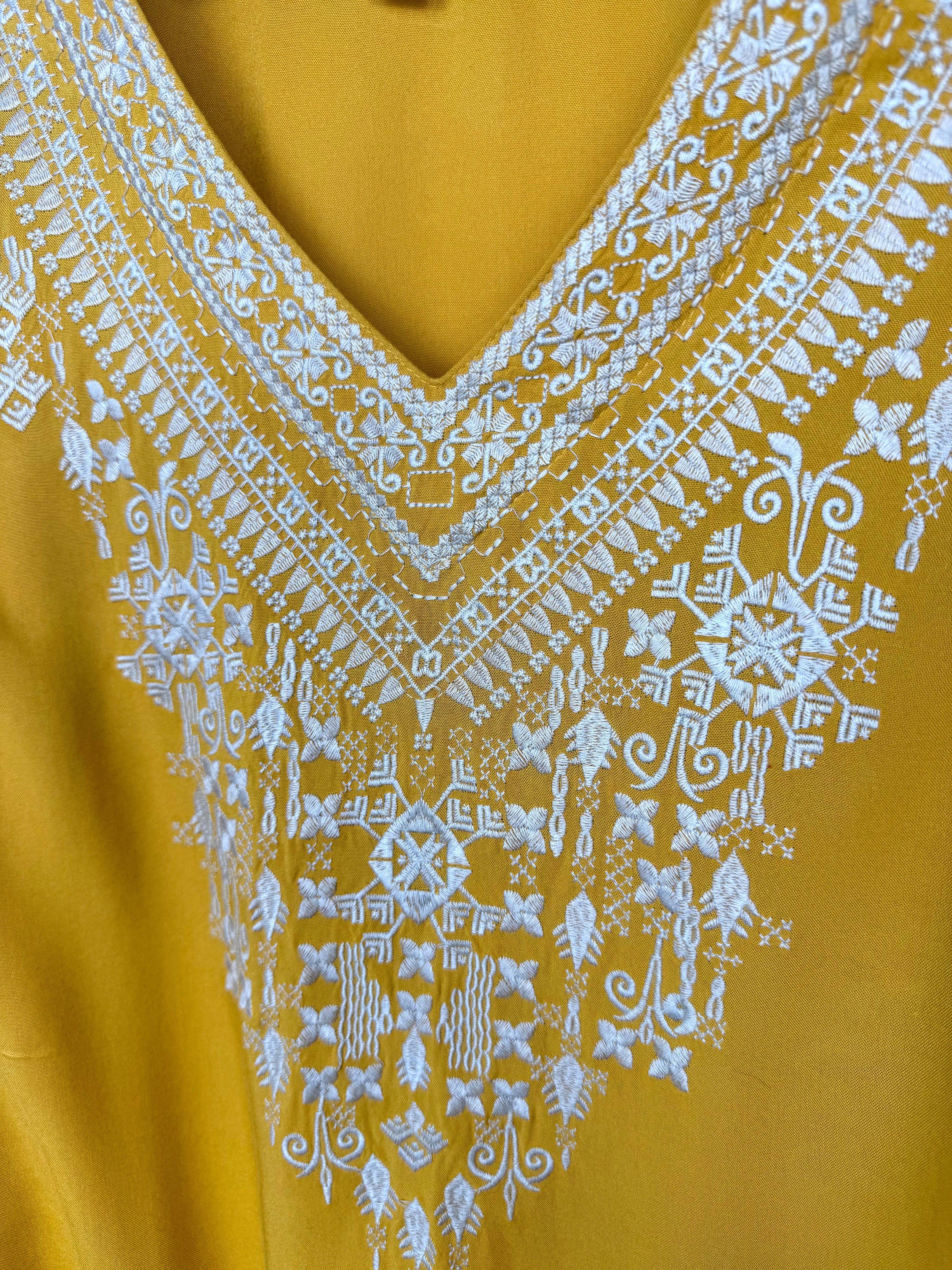 close up of neckline on Chelsea & Theodore Embroidered Boho Blouse 
