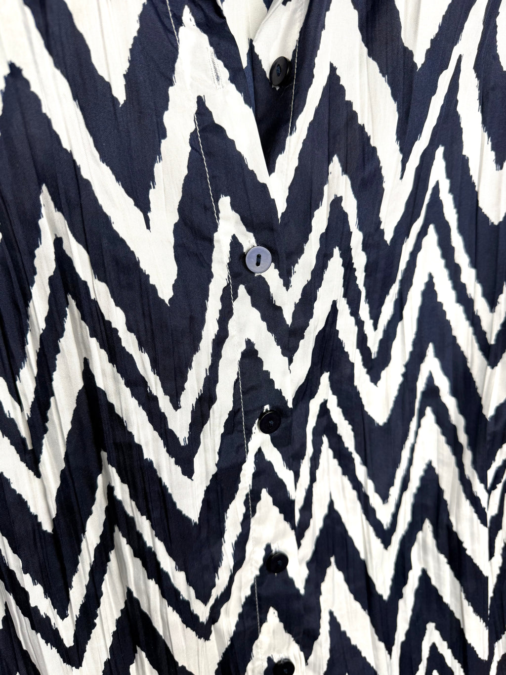 close up of pattern on Chico's blouse - chevron pattern navy and white
