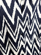 close up of pattern on Chico's blouse - chevron pattern navy and white
