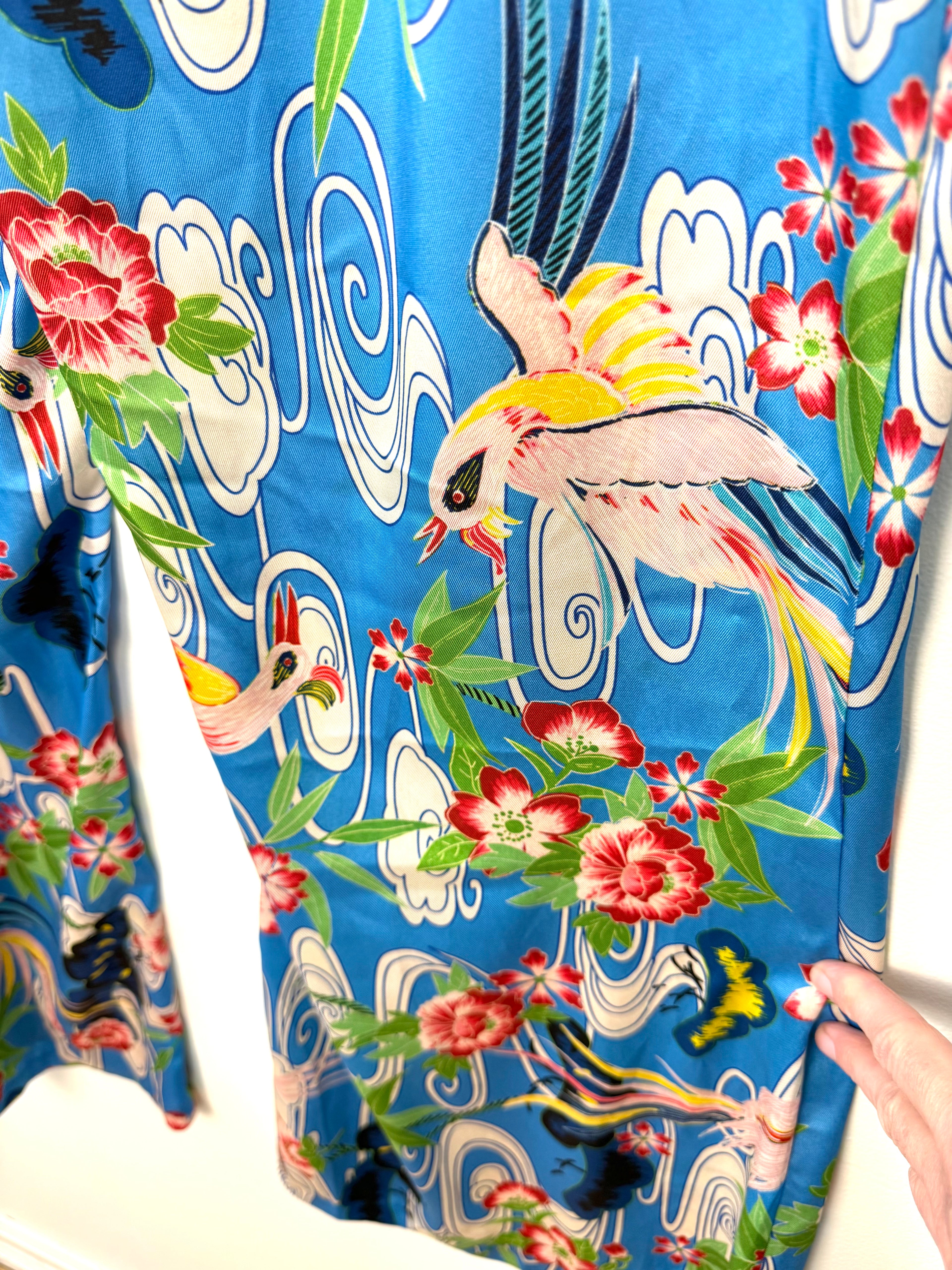 close up of pattern on Zara blue tropical bird floral wide leg pants