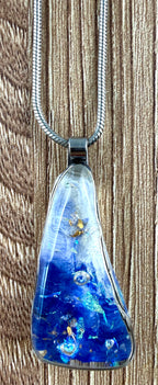 close up of pendant on Locally handcrafted cobalt blue resin or dichroic art glass pendant necklace on silver snake chain at Blue Sparrow Shop 