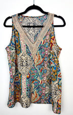 colourful paisley bohemian blouse with crochet lace neckline on hanger