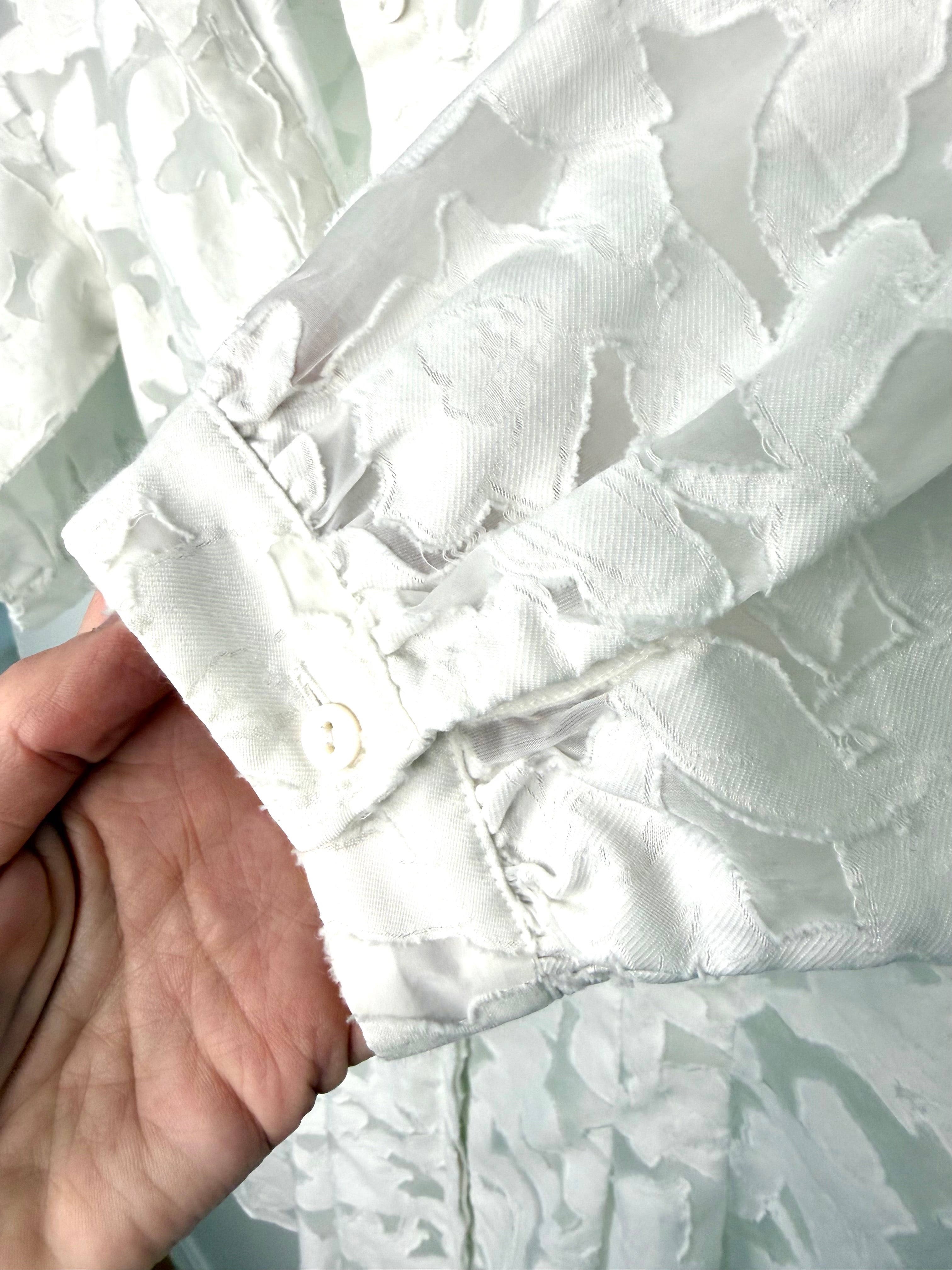 cuff detail on Club Monaco white burnout shirt dress with brocade pattern 