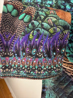 Luxury Camilla Franks resort wear leggings featuring a vibrant animal print design with crystal embellished ankle detailing. cuff detail 