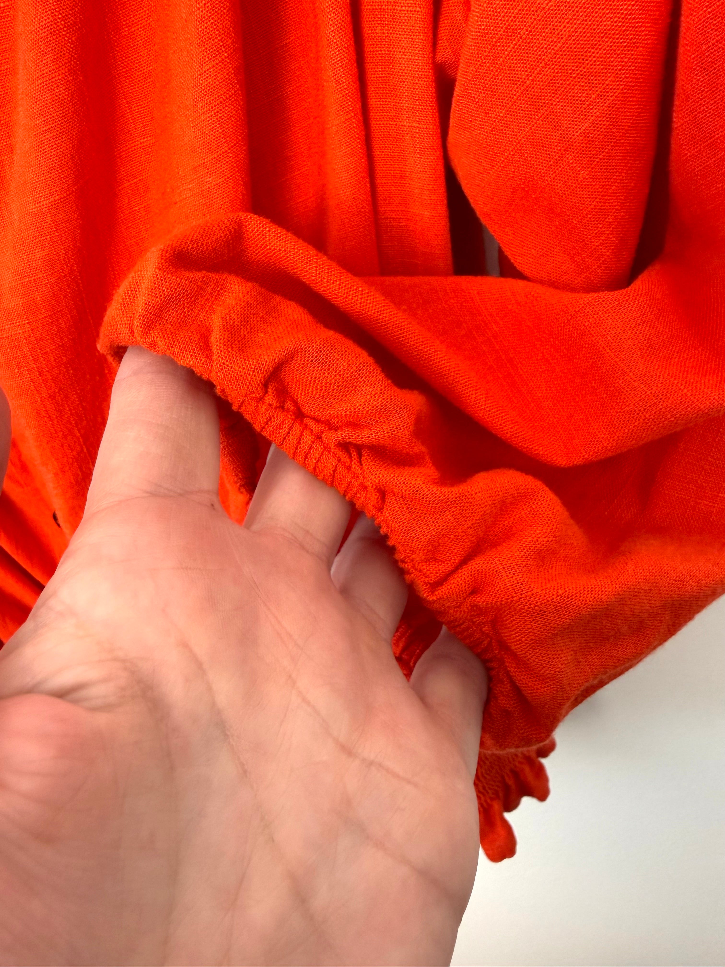 cuff detail on Melanie Lyne orange peasant blouse