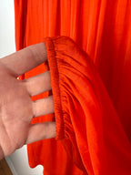 cuff detail on Rachel Zoe Vibrant Orange boho blouse 