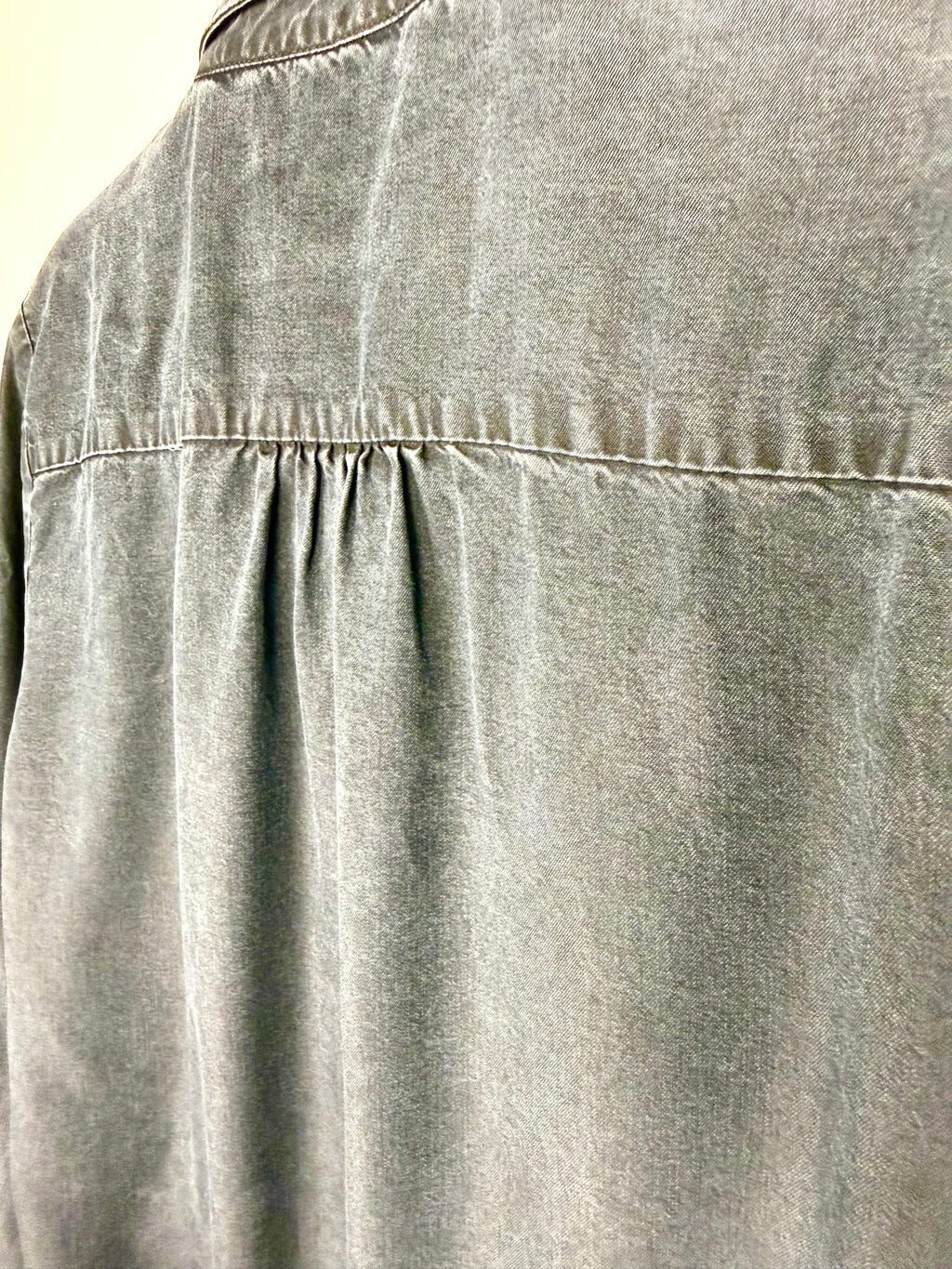 detail on back of Sandwich Denim Studio Amsterdam charcoal 100% Tencel shirt with stunning hand-applied blue crystal collar embellishment and ruffle cuff detail at Blue Sparrow Shop - looks grey but it's actually navy 