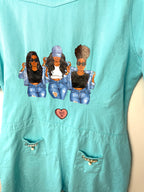 detailed view of decal and decor on back of Oversized Turquoise denim romper 