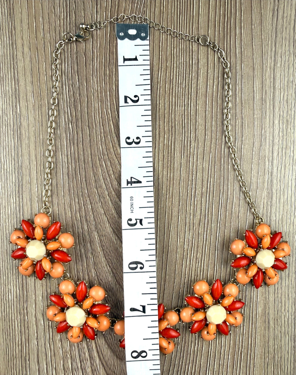 floral statement necklace with clustered flower design measuring approx 16"