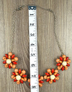 floral statement necklace with clustered flower design measuring approx 16"