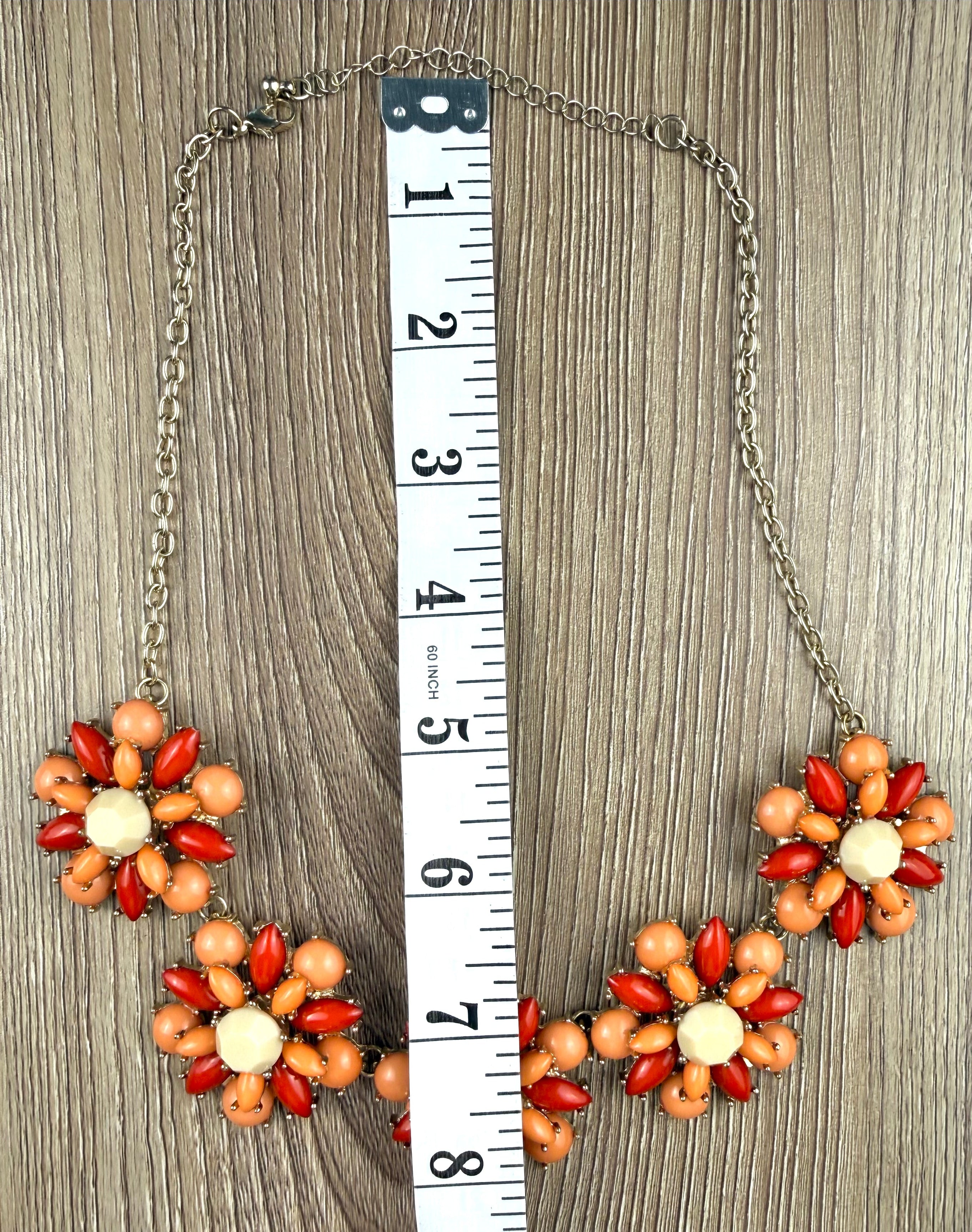 floral statement necklace with clustered flower design measuring approx 16"