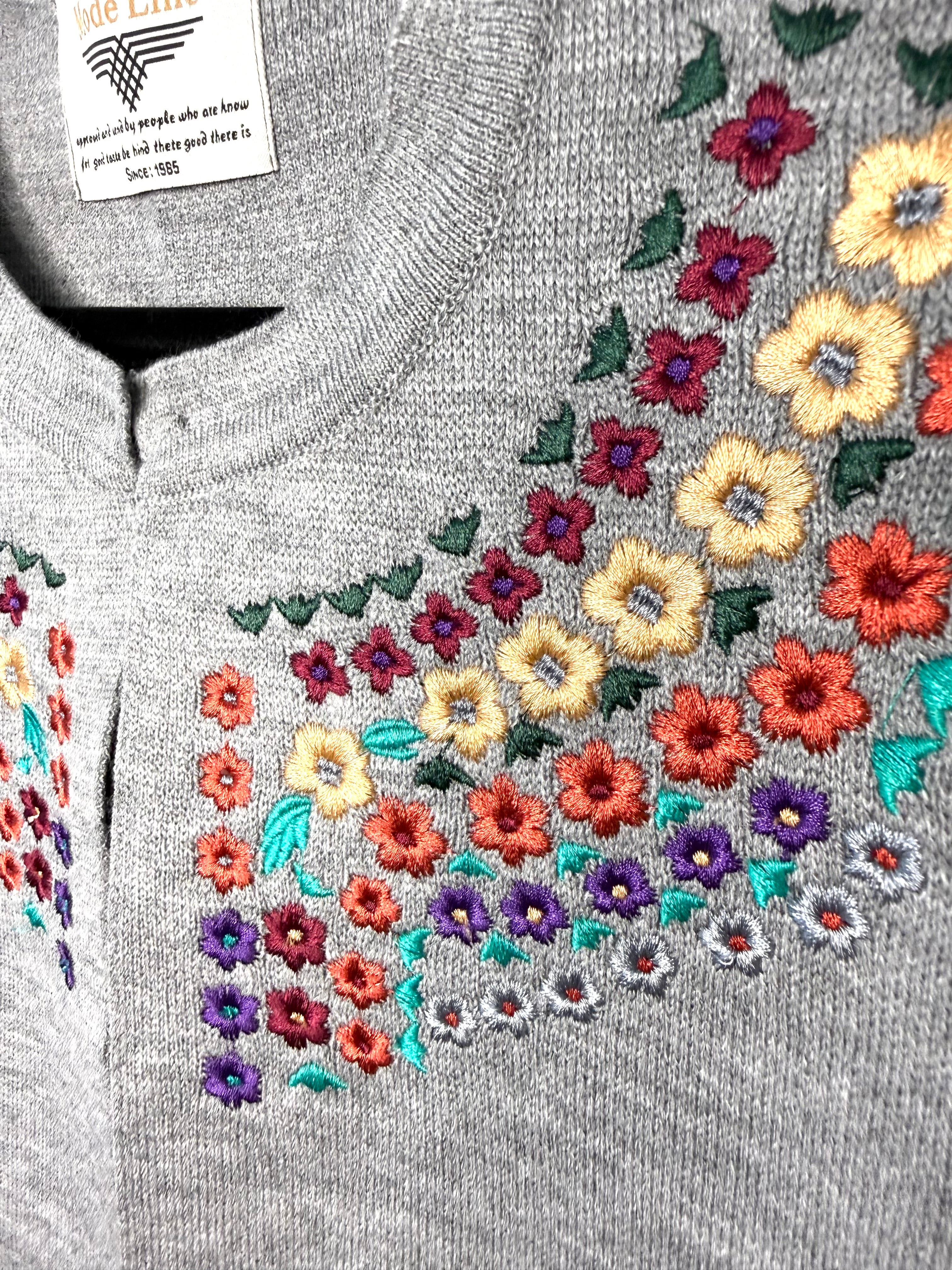 folk art floral embroidery knit sweater vest retro prairie style embroidered detail close up 