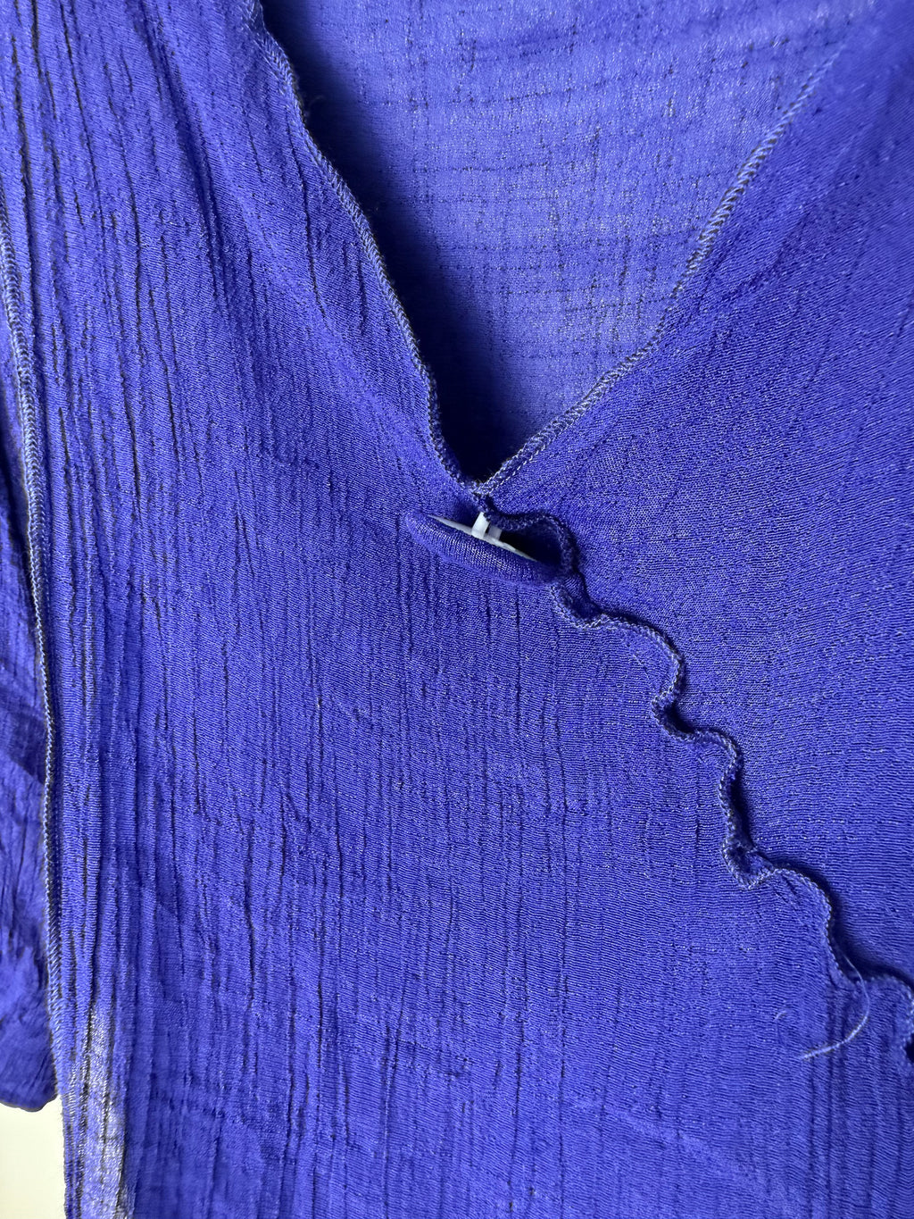 front button detail on neckline of Red Coral Royal Blue Asymmetrical Tunic Top 