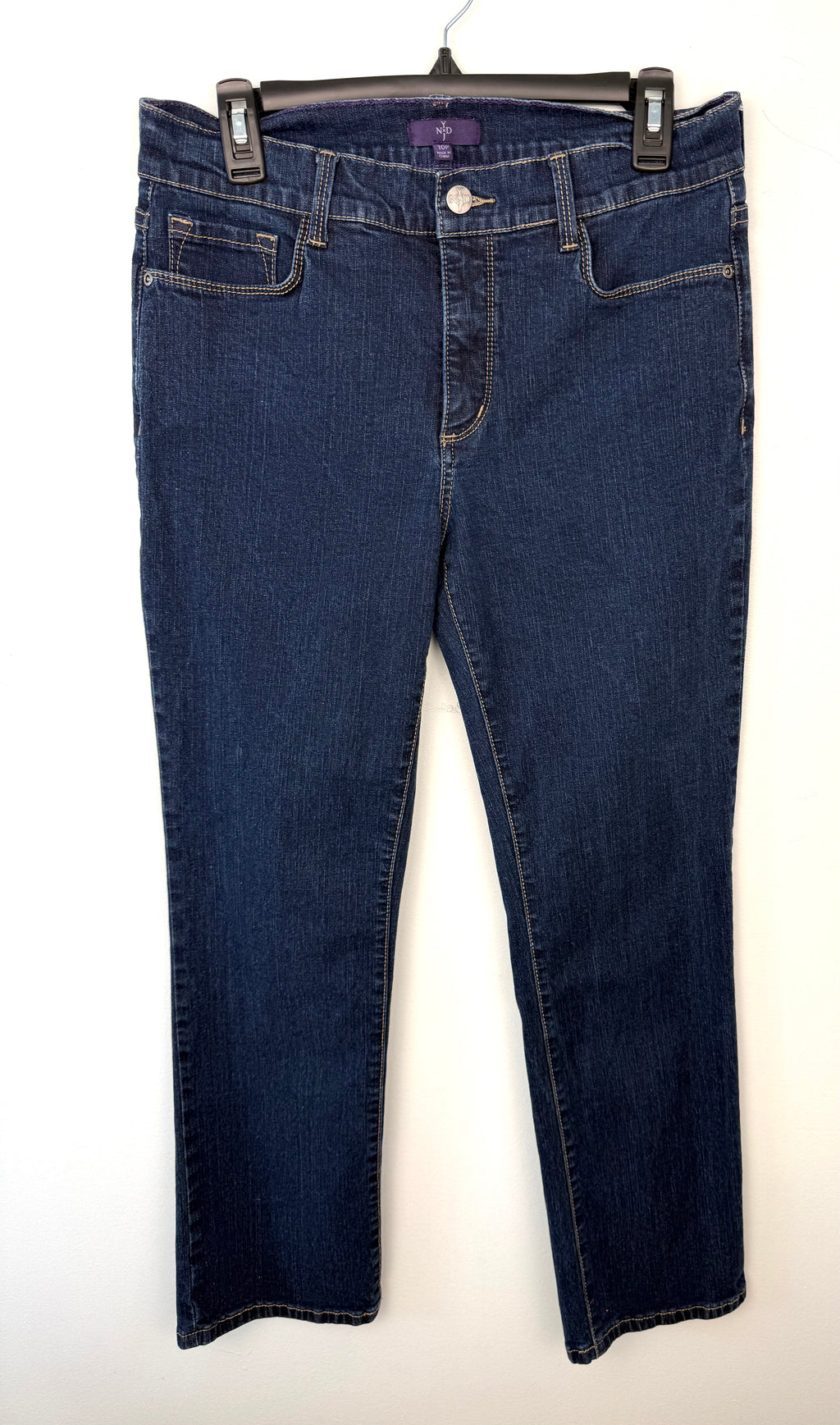 front of 99% Cotton NYDJ Dark Wash Petite Straight Leg Jeans | Size 10P at Blue Sparrow Shop on hanger