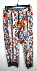 front of Casual boho patterned wide leg pants in orange and blue on hanger